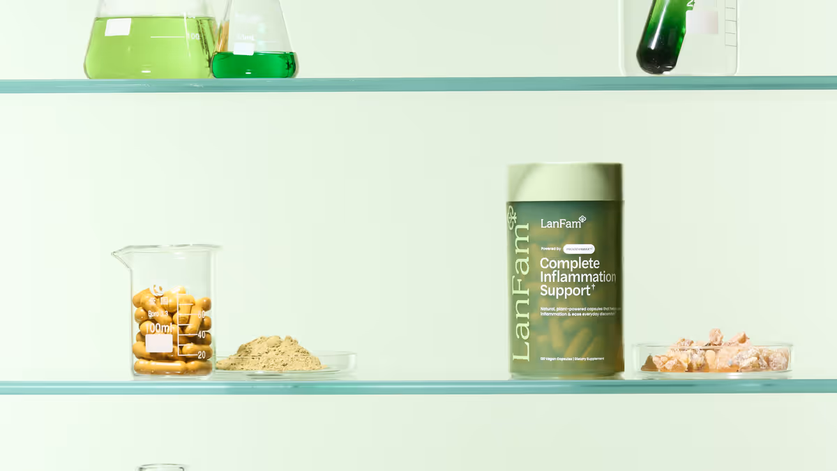 A ProleevaMax jar on a glass laboratory shelf beside beakers of capsules and powders