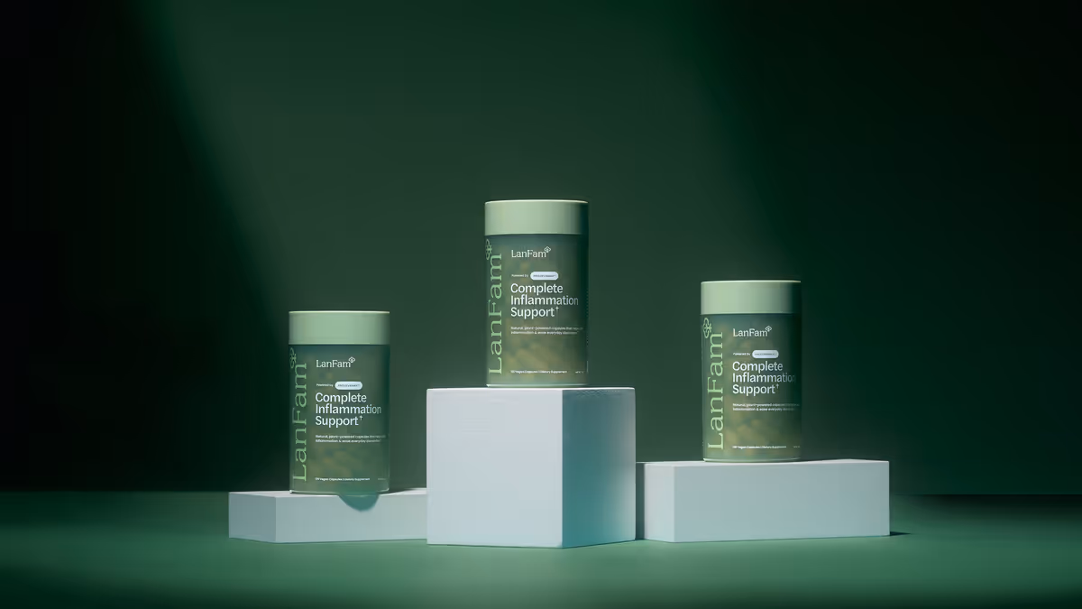 Three ProleevaMax jars on white podiums of different heights against dark green