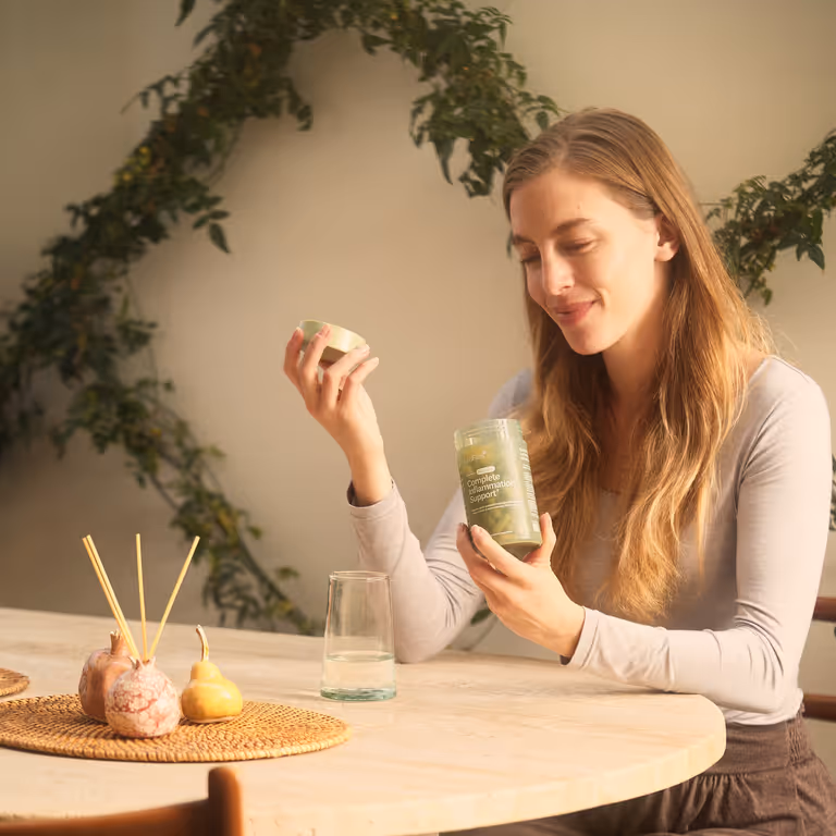 Woman Taking Capsule Table